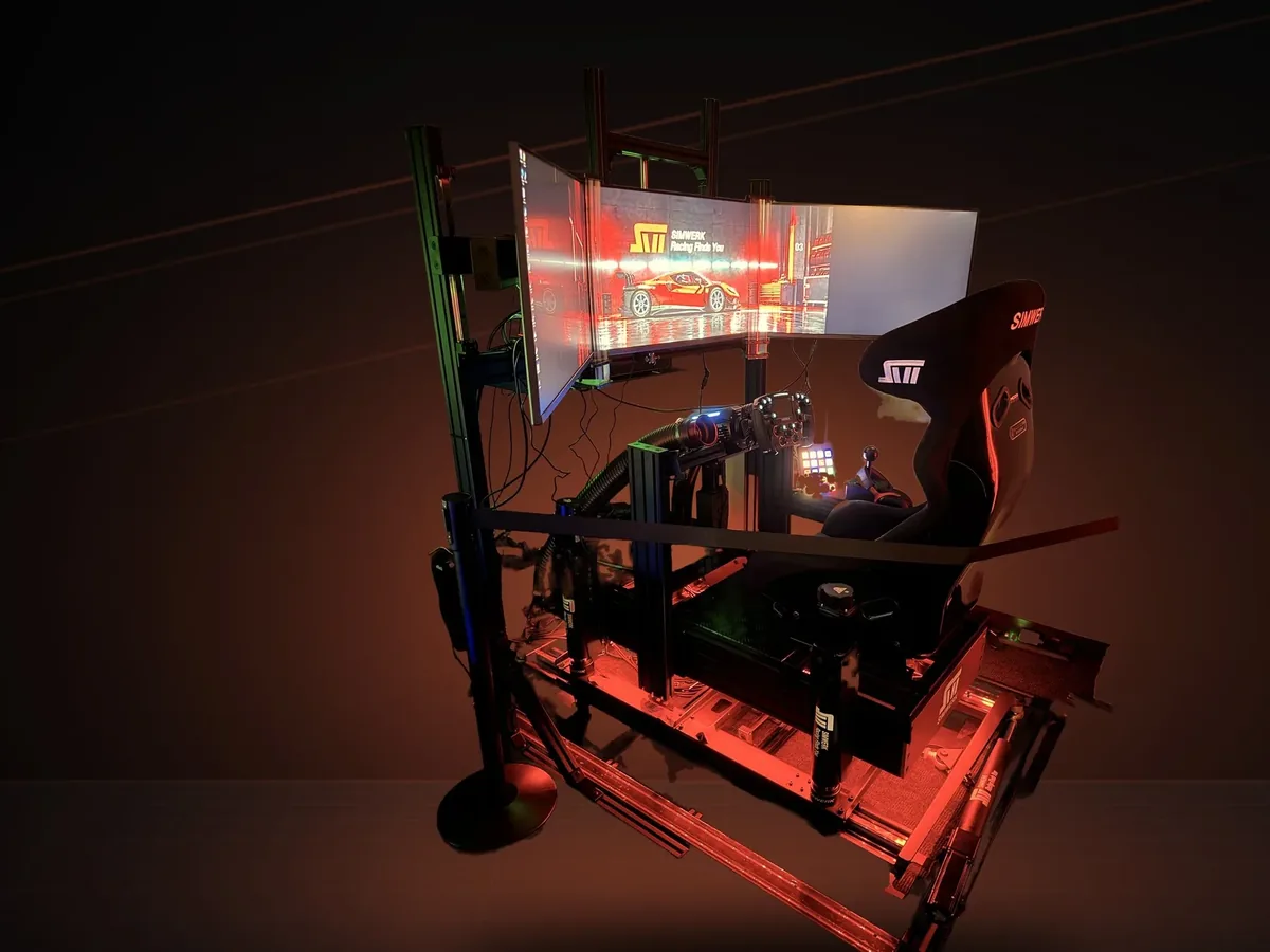 ASOC-03 at Pro Shop 01, a SimWerk Grand on SimWerk 7DOF motion with triple displays and the motion platform lit red (photo)