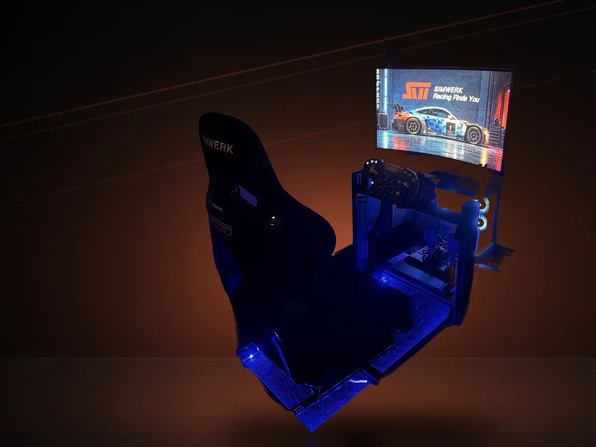 ASOC-01 at Pro Shop 01, a fixed SimWerk Core seen from above: SimWerk seat with blue underglow, MOZA wheel and a single display showing the SimWerk Racing Finds You screen (photo)